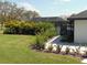 Private backyard with tropical landscaping, and screened-in pool area, perfect for relaxing at 2709 Fairway View Dr, Valrico, FL 33596