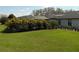 Expansive grassy backyard featuring lush landscaping, mature trees and plenty of room to roam at 2709 Fairway View Dr, Valrico, FL 33596