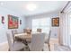 A cozy dining room showcasing a table with chairs, bright window, and natural lighting at 2709 Fairway View Dr, Valrico, FL 33596