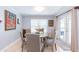 Dining room featuring a wood table with seating and a large window for natural light at 2709 Fairway View Dr, Valrico, FL 33596