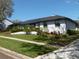 Beautiful home featuring updated windows, brick facade, lush landscaping, and mature trees at 2709 Fairway View Dr, Valrico, FL 33596