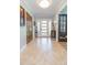 Inviting foyer showcasing a modern front door and decorative accents on tiled floors at 2709 Fairway View Dr, Valrico, FL 33596