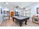 This game room boasts a pool table, wet bar, and a cozy seating area for entertaining guests at 2709 Fairway View Dr, Valrico, FL 33596