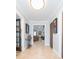 Hallway leading to a living room with a fireplace and unique decor at 2709 Fairway View Dr, Valrico, FL 33596
