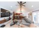 View of an open living area with modern seating, kitchen access, and a bright, airy atmosphere at 2709 Fairway View Dr, Valrico, FL 33596