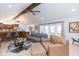 An open concept living area featuring an adjacent kitchen and modern furnishings at 2709 Fairway View Dr, Valrico, FL 33596