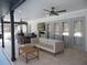 This covered patio features bar seating, a sofa set, recessed lights, and a ceiling fan at 2709 Fairway View Dr, Valrico, FL 33596