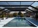 Inviting screened-in pool with clear water and a spacious deck, surrounded by lush landscaping at 2709 Fairway View Dr, Valrico, FL 33596