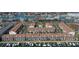 Aerial view of waterfront condos, showing boat docks, complex layout, and nearby waterway at 325 Madeira Cir, Tierra Verde, FL 33715