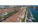Aerial view of waterfront townhouses with boat docks, providing direct access to the open water at 325 Madeira Cir, Tierra Verde, FL 33715