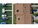 Aerial view of roof and boat docks on a sunny day over clear water at 325 Madeira Cir, Tierra Verde, FL 33715