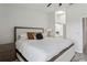 Tastefully decorated bedroom featuring a Queen bed, wood furnishings and ensuite bath at 325 Madeira Cir, Tierra Verde, FL 33715