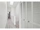 Bright hallway features luxury vinyl plank flooring and ample closet space at 325 Madeira Cir, Tierra Verde, FL 33715