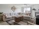 Comfortable living room area with a fireplace, modern decor, and ample natural light at 325 Madeira Cir, Tierra Verde, FL 33715