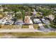 An aerial view showcases this home's location in a neighborhood with mature trees at 350 51St N Ave, St Petersburg, FL 33703