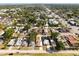 This aerial view highlights the property's neighborhood location and surrounding mature trees at 350 51St N Ave, St Petersburg, FL 33703