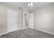 Simple bedroom with neutral carpet, and two closets and doors, offering ample storage at 350 51St N Ave, St Petersburg, FL 33703