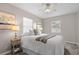 Bright bedroom with a ceiling fan, neutral walls, and large windows that provide ample natural light at 350 51St N Ave, St Petersburg, FL 33703