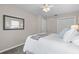 Neutral bedroom with a closet, a large mirror, and a ceiling fan for added comfort at 350 51St N Ave, St Petersburg, FL 33703