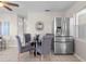This dining area features modern stainless steel refrigerator and seating for four at 350 51St N Ave, St Petersburg, FL 33703
