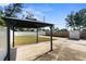 This backyard features a modern black gazebo, perfect for outdoor entertaining at 350 51St N Ave, St Petersburg, FL 33703