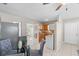 This dining area features a small kitchen with white appliances and wood cabinets at 350 51St N Ave, St Petersburg, FL 33703