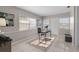 Bright office space with a desk and chair on a patterned rug, offering a functional workspace at 350 51St N Ave, St Petersburg, FL 33703