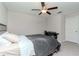 Bedroom featuring a large bed, desk, ceiling fan, and great natural light at 3533 N Maryland Ave, Plant City, FL 33565