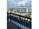 View from the balcony shows a parking area and views of the intercoastal waterway and nearby buildings at 400 Island Way # 509, Clearwater Beach, FL 33767