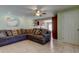 Comfortable living room featuring a large sectional sofa and an open view to the kitchen at 4200 Queen N St, St Petersburg, FL 33714