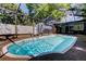 Backyard pool with screened enclosure provides privacy and outdoor enjoyment at 4200 Queen N St, St Petersburg, FL 33714