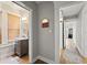 Bathroom featuring a wood vanity, framed mirror, and natural light at 5915 N Otis Ave, Tampa, FL 33604