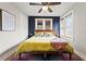 Cozy bedroom featuring natural light, hardwood floors, and stylish decor at 5915 N Otis Ave, Tampa, FL 33604