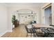 Dining room showcasing a rustic table and four chairs, with an open view to the living room at 5915 N Otis Ave, Tampa, FL 33604