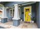 Close up of front door with two stately columns and tiled porch at 5915 N Otis Ave, Tampa, FL 33604