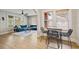 Bright living room featuring a blue sofa, ceiling fan and beautiful natural light at 5915 N Otis Ave, Tampa, FL 33604