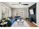 Bright living room with a comfortable blue sectional and modern decor at 5915 N Otis Ave, Tampa, FL 33604