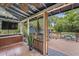 Comfortable covered patio with a ceiling fan and a view of the outdoor deck at 5915 N Otis Ave, Tampa, FL 33604