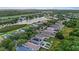 Expansive aerial shot of the neighborhood showcasing well-maintained homes and serene lake views at 7842 Carriage Pointe Dr, Gibsonton, FL 33534