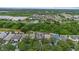 Stunning aerial view of homes in a lush community, offering picturesque scenery and a tranquil living environment at 7842 Carriage Pointe Dr, Gibsonton, FL 33534