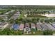 Overhead view capturing a residential area with well-kept lawns and various home styles at 7842 Carriage Pointe Dr, Gibsonton, FL 33534