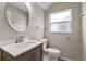 Cozy bathroom featuring a single sink vanity with modern faucet and a frosted glass window at 7842 Carriage Pointe Dr, Gibsonton, FL 33534