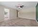 Bedroom featuring a ceiling fan and an adjoining bathroom at 7842 Carriage Pointe Dr, Gibsonton, FL 33534