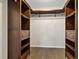 Walk-in closet featuring wood shelving and a metal hanging rod at 7842 Carriage Pointe Dr, Gibsonton, FL 33534
