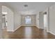 Spacious dining room boasting hardwood floors, arched doorways, and neutral paint at 7842 Carriage Pointe Dr, Gibsonton, FL 33534