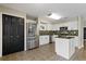 Stylish kitchen featuring stainless appliances, a center island and sleek white cabinetry at 7842 Carriage Pointe Dr, Gibsonton, FL 33534