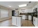 Modern kitchen showcasing granite counters, stainless steel appliances, and a center island at 7842 Carriage Pointe Dr, Gibsonton, FL 33534