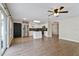 Bright open-concept kitchen with white cabinets, stainless steel appliances, and island at 7842 Carriage Pointe Dr, Gibsonton, FL 33534