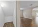 A walk-in storage space features ample room for storing items and a light for visibility at 7842 Carriage Pointe Dr, Gibsonton, FL 33534