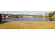 Panoramic view of the backyard overlooking a serene lake at 8556 Tidal Bay Ln, Tampa, FL 33635